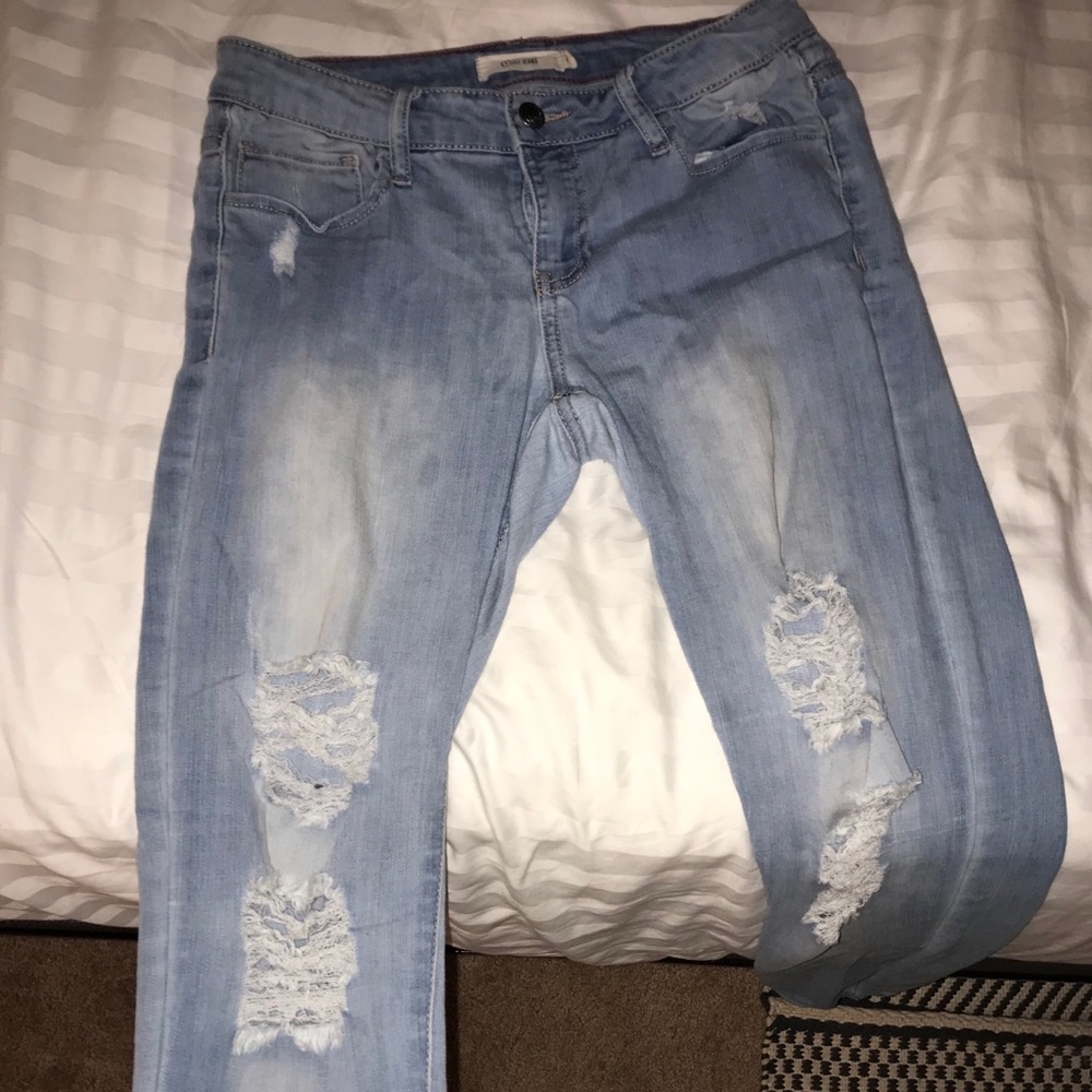 Light wash mid rise jeans.